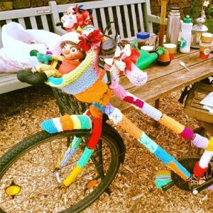 Freya Perry Yarn-bombing a bicycle
